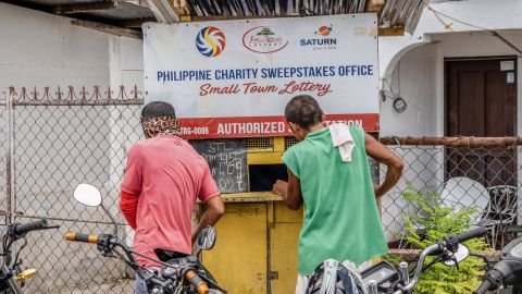 Lottery hopefuls in Cebu, Philippines, buy tickets at one of many local vendors. 