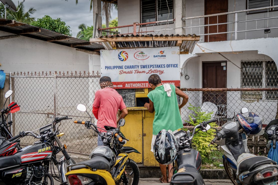 Lottery hopefuls in Cebu, Philippines, buy tickets at one of many local vendors. 