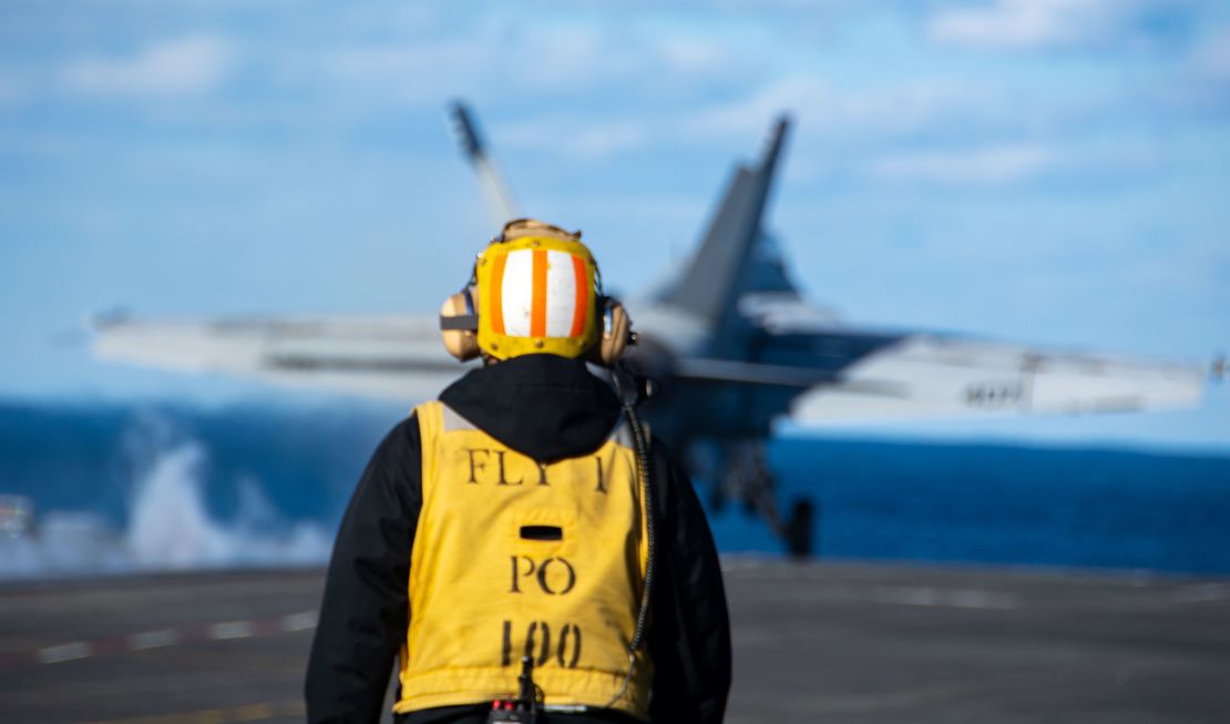 A USS Ronald Reagan crew members observes the launch of an F/A-18E Super Hornet fighter jet in the Sea of Japan on Wednesday.