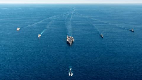 A US aircraft carrier and submarine, and South Korean and Japan warships, seen during a joint exercise on September 30.
