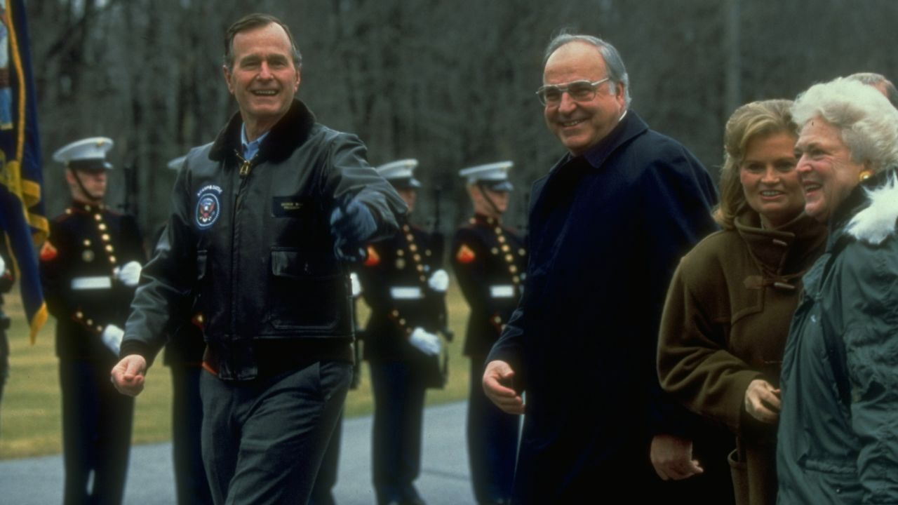 Pres. George Bush (R) & wife Barbara (L) greeting W. German Chancellor Helmut Kohl & wife Hannelore, on arrival at Camp David.
