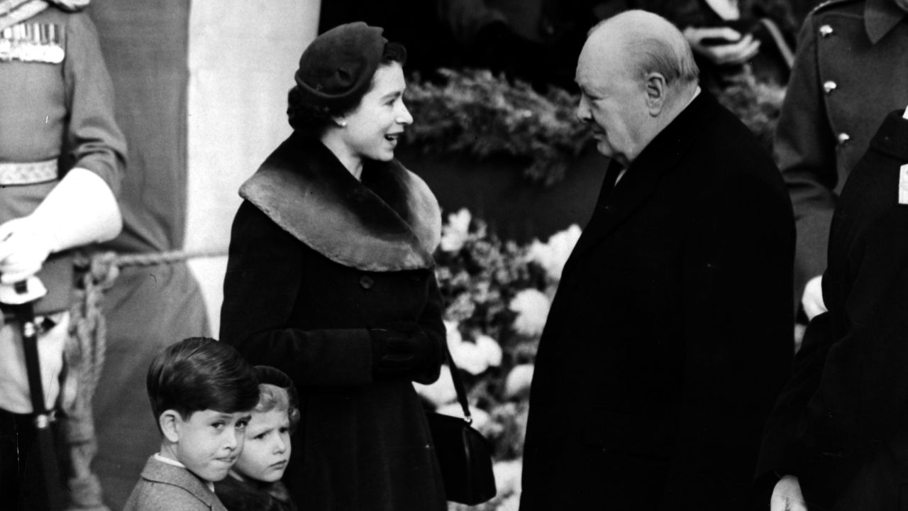 Elizabeth II, Queen of England with Prince Charles and Princess Anne chatting to Sir Winston Churchill (1874 - 1965) in 1953.