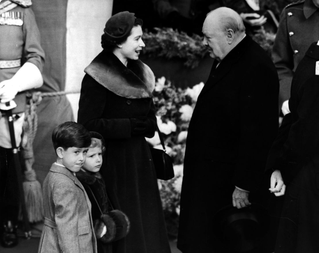 Elizabeth II, Queen of England with Prince Charles and Princess Anne chatting to Sir Winston Churchill (1874 - 1965) in 1953. 