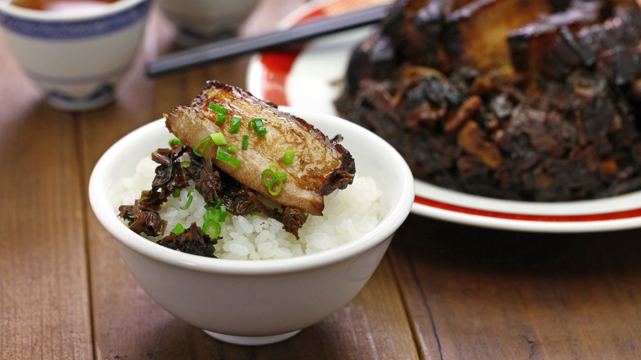 <strong>Steamed pork belly with preserved mustard greens: </strong>The tender, well-braised pork belly is irresistible, but the star of this Hakkan dish is <em>mei cai</em>, a dry, pickled Chinese mustard that gives the hearty stew its slightly sour and salty taste.