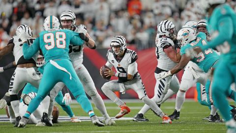 Burrow runs with the ball in the second quarter against the Miami Dolphins.