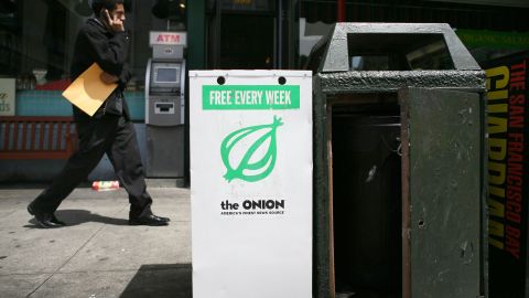 A pedestrian walks by an Onion news rack May 5, 2009 in San Francisco, California. 