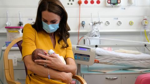 The Princess of Wales spoke with mew mother Sylvia Novak (unseen), whilst holding Sylvia's new-born daughter Bianca, during a visit to the Royal Surrey County Hospital's maternity unit in Guildford, south west of London on October 5. 