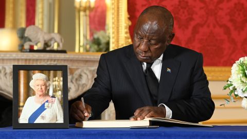 South African President Cyril Ramaphosa signs a book of condolence at Lancaster House on September 18, 2022 in London.
