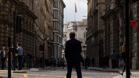 City of London workers walk near the Bank of England on Monday, Oct. 3.