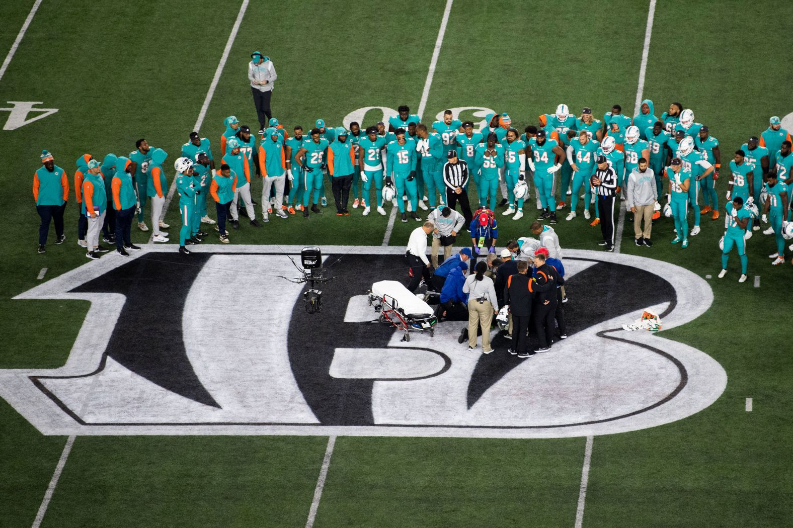 Teammates gather around Miami Dolphins quarterback Tua Tagovailoa after he suffered a concussion during a game against the Cincinnati Bengals on Thursday, September 29. <a href="https://www.cnn.com/2022/10/03/sport/nfl-concussion-scrutiny-tua-tagovailoa-spt-intl" target="_blank">An investigation is now underway</a> into the handling of Tagovailoa's apparent head injury, while the unaffiliated neurotrauma consultant who was involved in the quarterback's first concussion evaluation four days earlier is reportedly no longer working with the National Football League Players Association.
