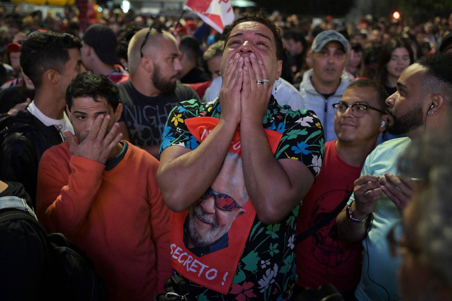 Supporters of Brazilian former President Luiz Inácio "Lula" da Silva react as they watch the vote count of <a href="https://www.cnn.com/2022/10/03/world/gallery/brazil-elections" target="_blank">the presidential election</a> in Sao Paulo, Brazil, on Sunday, October 2. Da Silva's race against far-right President Jair Bolsonaro will go to a second round after no candidate achieved more than 50% of the vote.