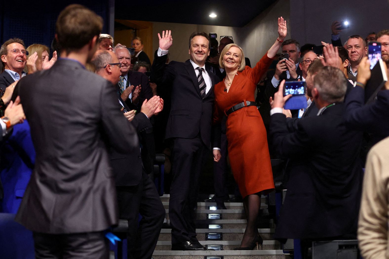 British Prime Minister Liz Truss and her husband, Hugh O'Learyat, wave during <a href="https://www.cnn.com/2022/10/05/uk/liz-truss-conservative-party-conference-speech-gbr-intl" target="_blank">the Conservative party's annual conference</a> in Birmingham, England, on Wednesday, October 5.