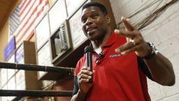 Herschel Walker, the Republican U.S. Senate candidate for Georgia, speaks to supporters at the Northeast Georgia Livestock Barn in Athens, Ga., on Wednesday, July 20, 2022. Walker spoke about gas prices and the November election. (Joshua L. Jones/Athens Banner-Herald via AP)