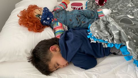 Kayla Lopez caught her son Dominic sleeping with his beloved Chucky doll. He shocked his young friends when he asked for the doll for his third birthday. 