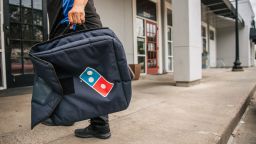 A Domino's Pizza employee returns from a delivery on July 22, 2021 in Houston, Texas. 
