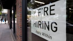 A hiring sign posted on the window of a retail store in Washington, D.C., on Aug. 5, 2022.