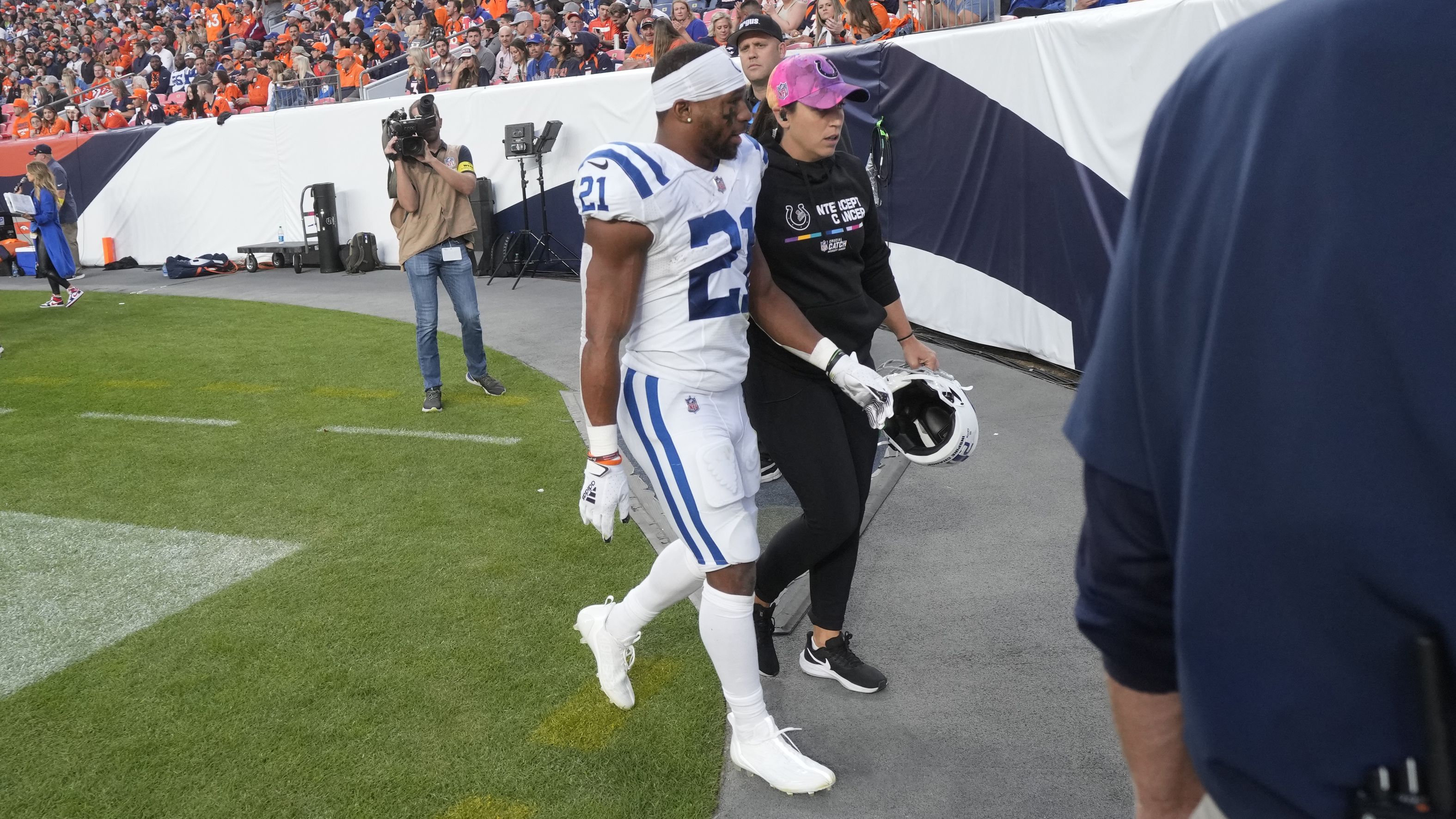 Indianapolis Colts running back Nyheim Hines leaves the field after an injury during the first half of an NFL football game against the Denver Broncos, Thursday, October 6, 2022, in Denver. 