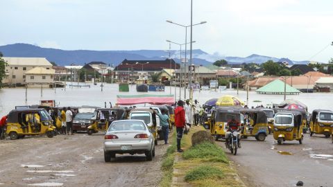 Thousands of travelers remained stranded in Nigeria's north-central Kogi state after major connecting roads to other parts of the West African nation were submerged in floods, locals and authorities said Thursday.