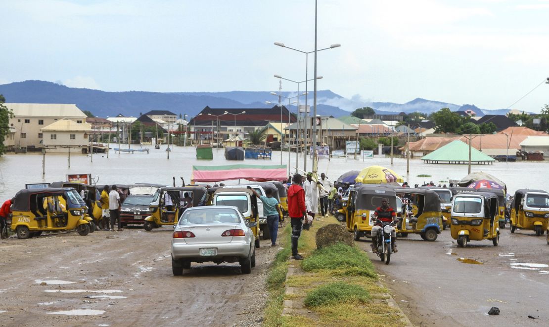 Thousands of travelers remained stranded in Nigeria's north-central Kogi state after major connecting roads to other parts of the West African nation were submerged in floods, locals and authorities said Thursday.
