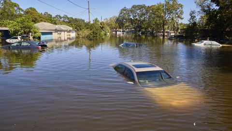 Vehicles and homes submerged in water in a flooded neighborhood following Hurricane Ian in Orlando, Florida, on September 30, 2022. 