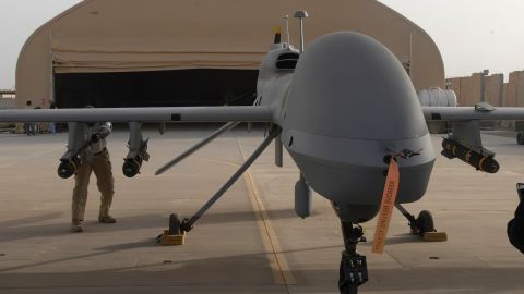 In this image provided by the US Army, contactors from General Atomics load Hellfire missiles onto an MQ-1C Gray Eagle at Camp Taji, Iraq, on February 27, 2011. 