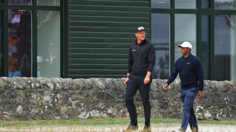 Meronk and Woods stroll past St. Andrews Old Course Hotel.