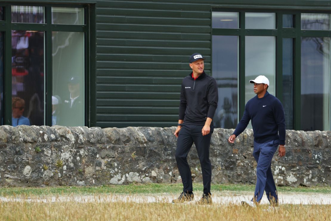 Meronk and Woods stroll past the St. Andrews Old Course Hotel.