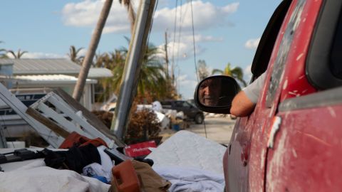 Charlie, in his red pick-up truck, has been a lifeline for the couple next door. 