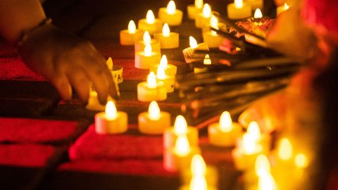 Students place down lights for a vigil in memory of Varun Manish Chheda on October 5 at Purdue University in West Lafayette, Indiana.