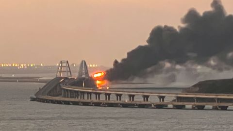 Smoke billows from fire on the Kerch bridge at sunrise on Saturday.