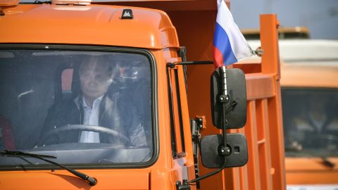 Putin drives a Kamaz truck during the opening ceremony of the bridge on May 15, 2018. 