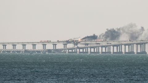 A view shows fuel tanks ablaze and damaged sections of the Kerch bridge on October 8, 2022. 
