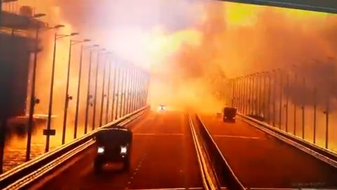 Surveillance footage on the Kerch bridge shows the moment of a large explosion on the roadway, with some vehicles apparently caught in the blast.