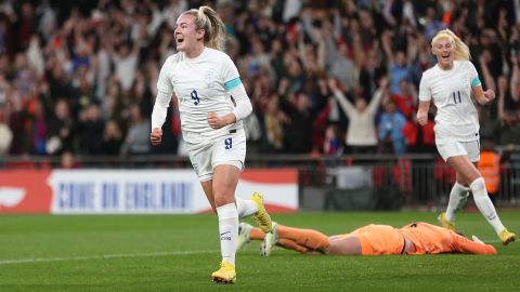 Lauren Hemp celebrates scoring her side's first goal.