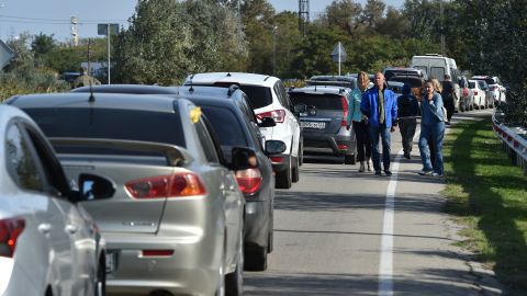 Cars queue for the ferry in Kerch, Crimea on Saturday after an explosion halted traffic on the bridge linking the peninsula with Russia.