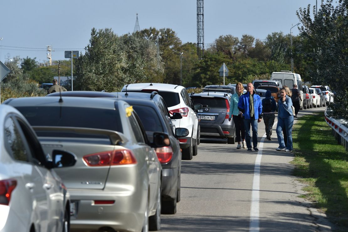 Cars queue for the ferry in Kerch, Crimea on Saturday after an explosion halted traffic on the bridge linking the peninsula with Russia.