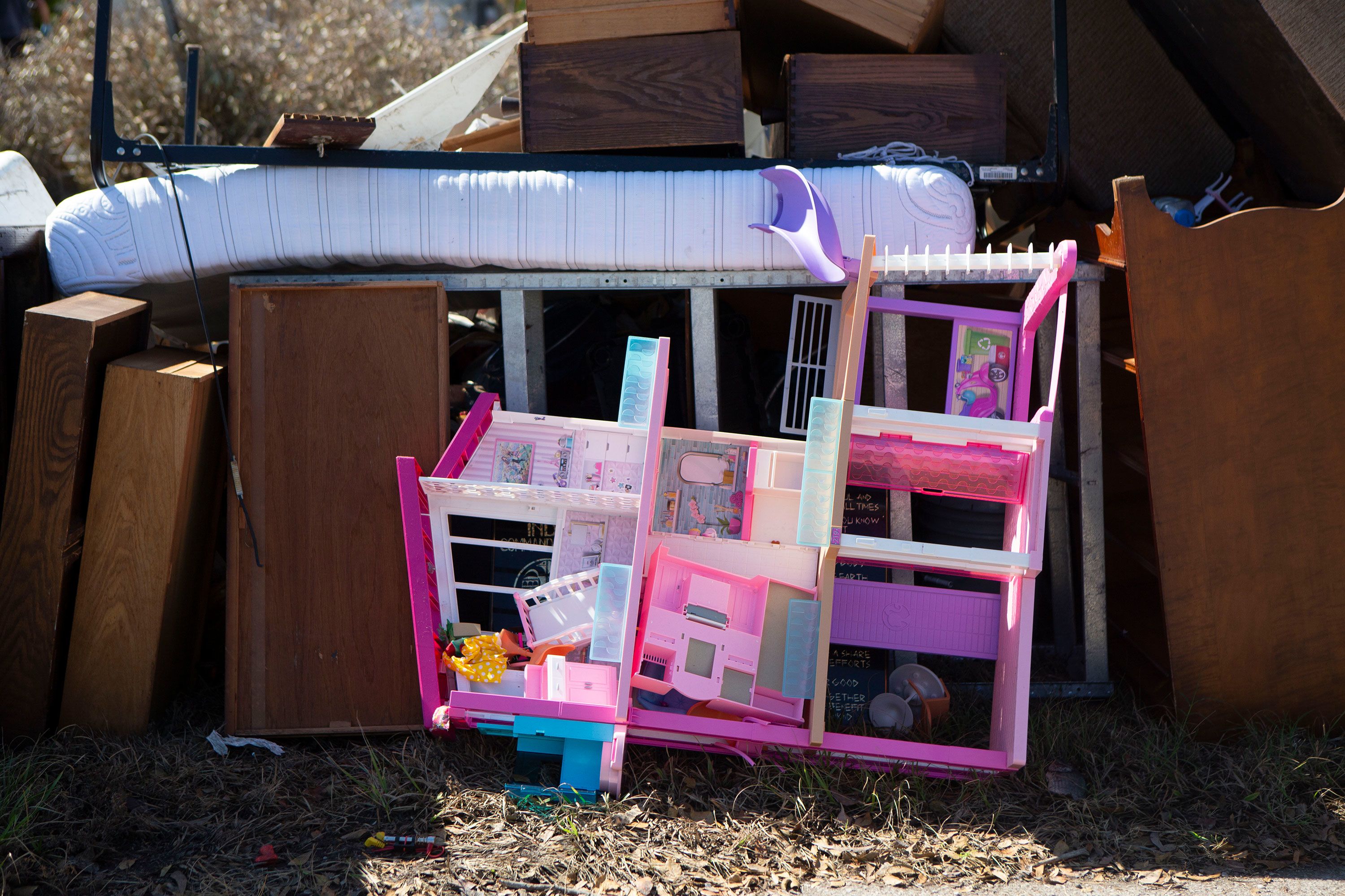 A dollhouse set is seen on the curb in the Whitewater Court neighborhood of Fort Myers Beach.