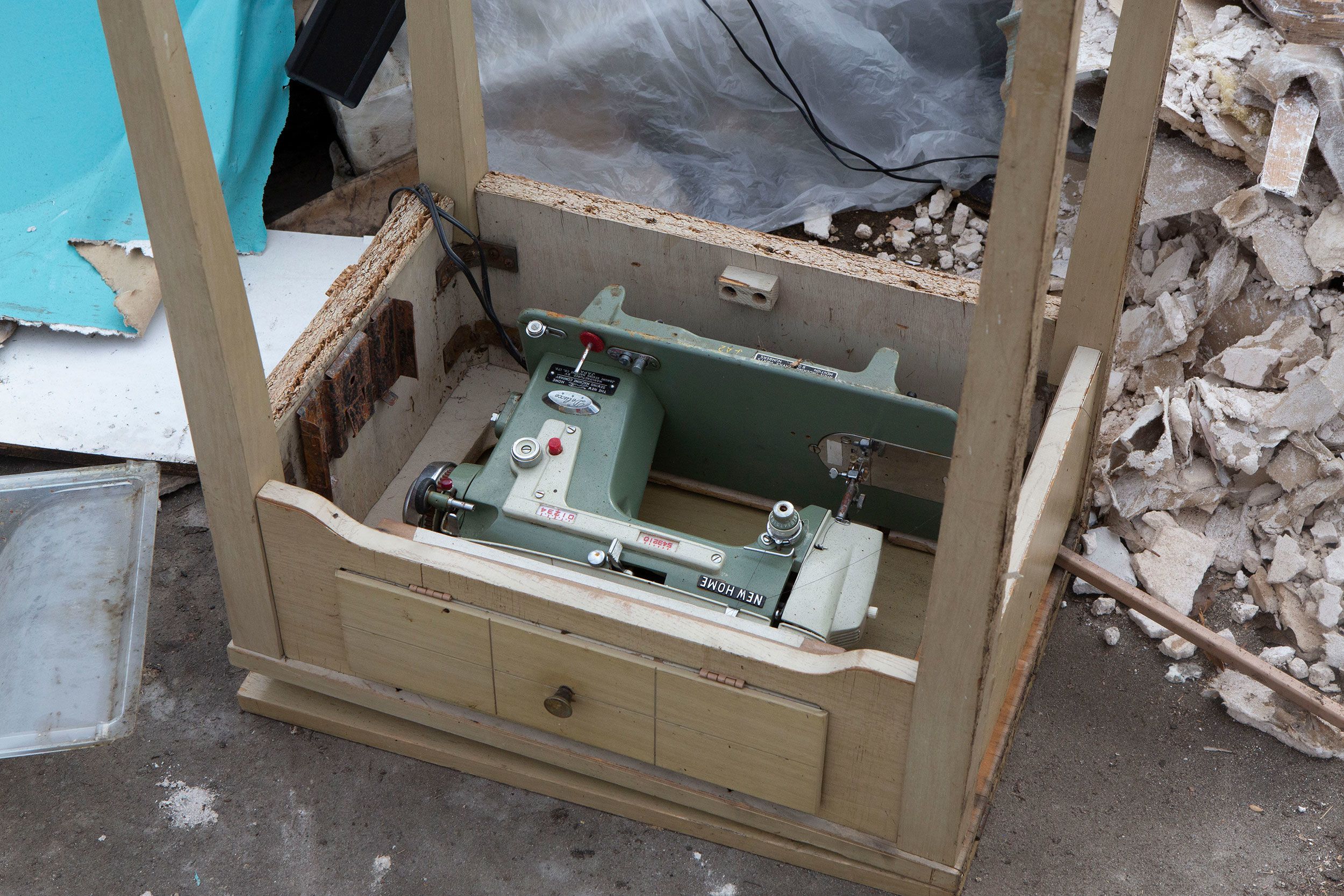 A sewing machine is seen waiting to be collected from the street curb off of Linda Loma Drive in Fort Myers.