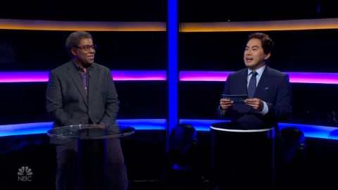Kenan Thompson, left, and Bowen Yang play 'So You Think You Won't Snap' during the cold open of 'Saturday Night Live.'
