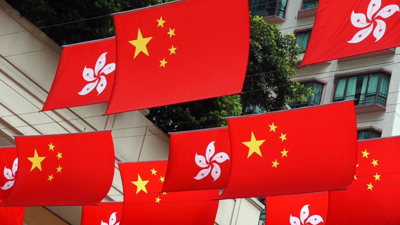 Chinese and Hong Kong flags decorate a street ahead of the 25th anniversary of the former British colony's handover to Chinese rule, in Hong Kong, China June 30, 2022. 