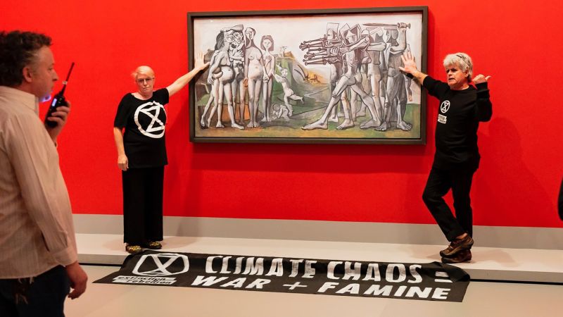 Extinction Rebellion activists glue themselves to Picasso painting | CNN