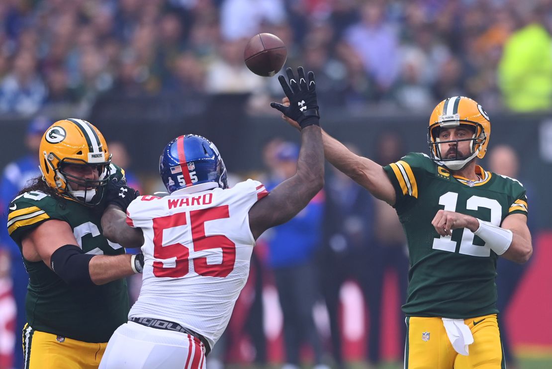 Rodgers throws a pass in the first half against the Giants.