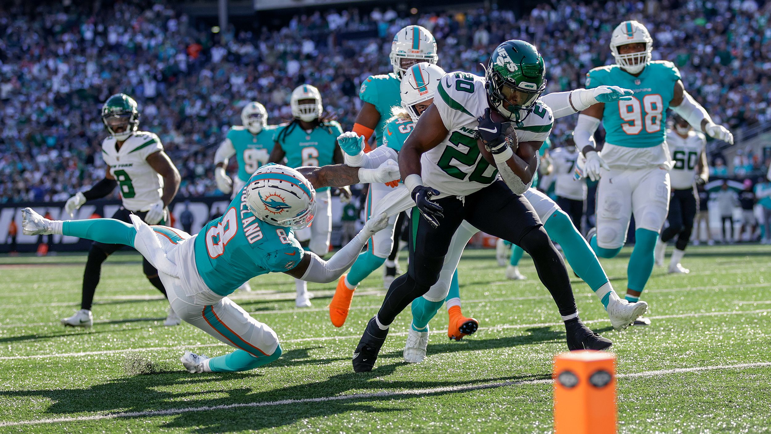 New York Jets running back Breece Hall carries the ball down to the one-yard line against the Miami Dolphins during the fourth quarter. Hall rushed for a touchdown in the Jets' 40-17 demolishing of the Dolphins. His TD was one of the Jets' four rushing touchdowns as they dominated Miami on the ground. 