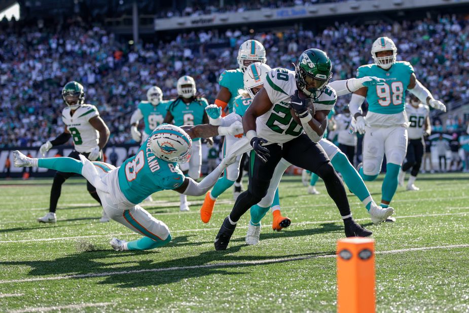 New York Jets running back Breece Hall carries the ball down to the one-yard line against the Miami Dolphins during the fourth quarter. Hall rushed for a touchdown in the Jets' 40-17 demolishing of the Dolphins. His TD was one of the Jets' four rushing touchdowns as they dominated Miami on the ground. 