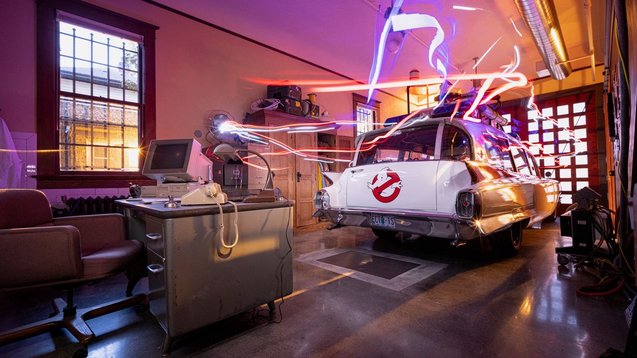 Ecto-1 is parked in the firehouse bay.