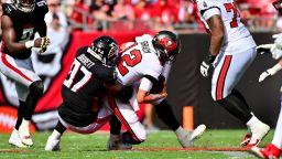 TAMPA, FLORIDA - OCTOBER 09: Grady Jarrett #97 of the Atlanta Falcons sacks Tom Brady #12 of the Tampa Bay Buccaneers during the fourth quarter of the game at Raymond James Stadium on October 09, 2022 in Tampa, Florida. (Photo by Julio Aguilar/Getty Images)