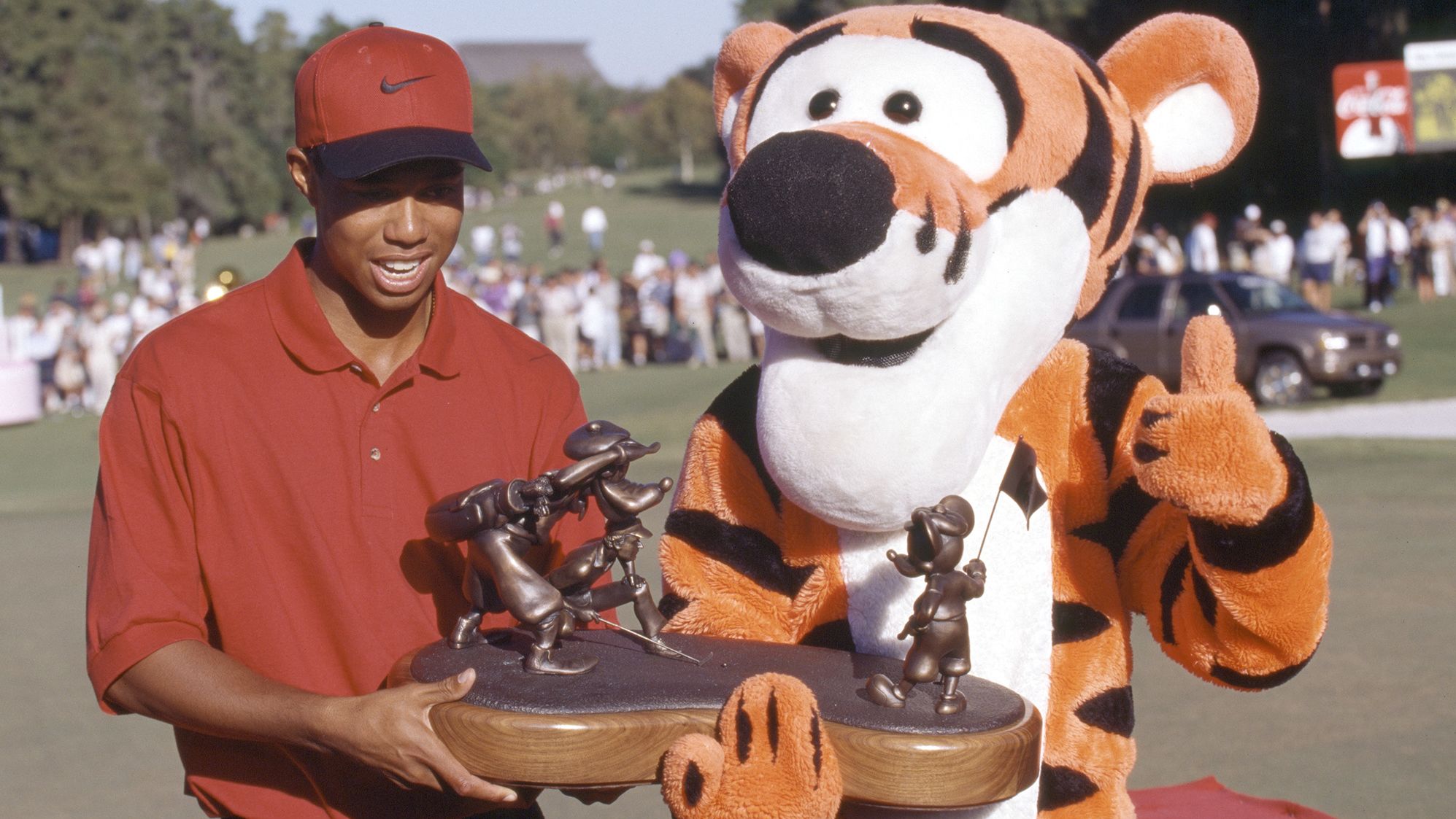 Woods celebrates victory at the 1996 Walt Disney World Golf Classic.