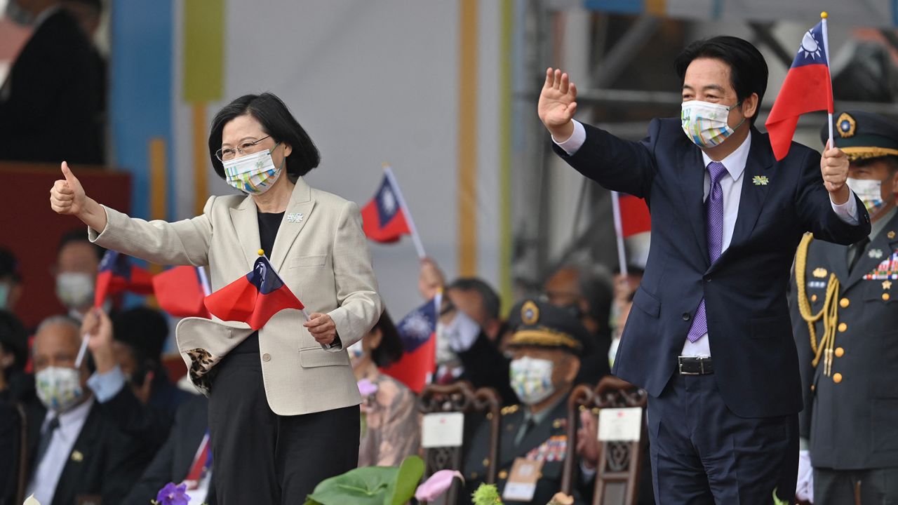 Taiwan's President Tsai Ing-wen (L) and Vice-President William Lai attend a ceremony to mark the island's National Day in front of the Presidential Office in Taipei on October 10, 2022.