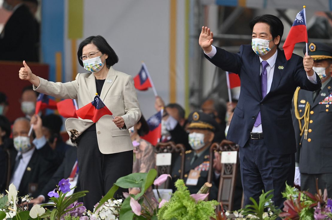 Taiwan's President Tsai Ing-wen (L) and Vice-President William Lai attend a ceremony to mark the island's National Day in front of the Presidential Office in Taipei on October 10, 2022.