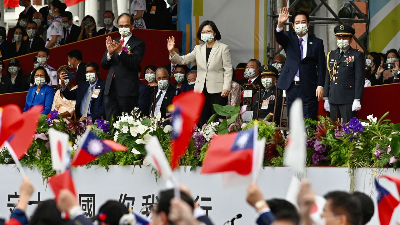 Taiwan's President Tsai Ing-wen (top C) attends a ceremony to mark the island's National Day in front of the Presidential Office in Taipei on October 10, 2022. 